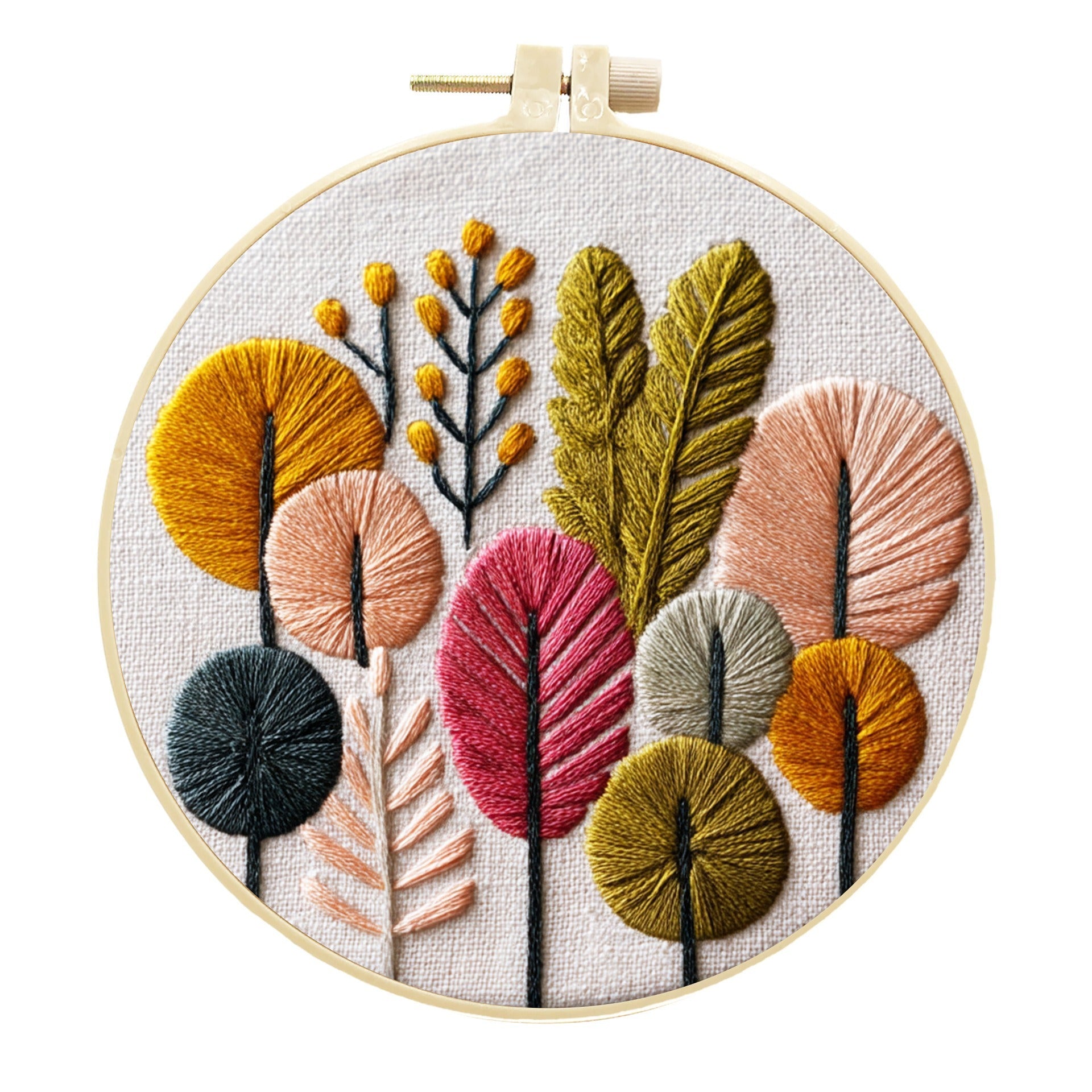 A round embroidery hoop displaying a colorful embroidered botanical design of stylized trees and leaves in mustard yellow, pink, sage green, peach, and dark teal on a white fabric background.