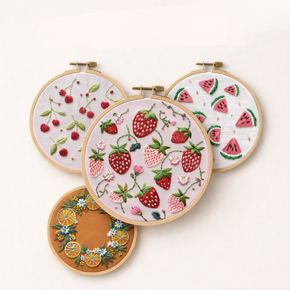 Four hoops with strawberry, watermelon, orange and cherry embroidery designs